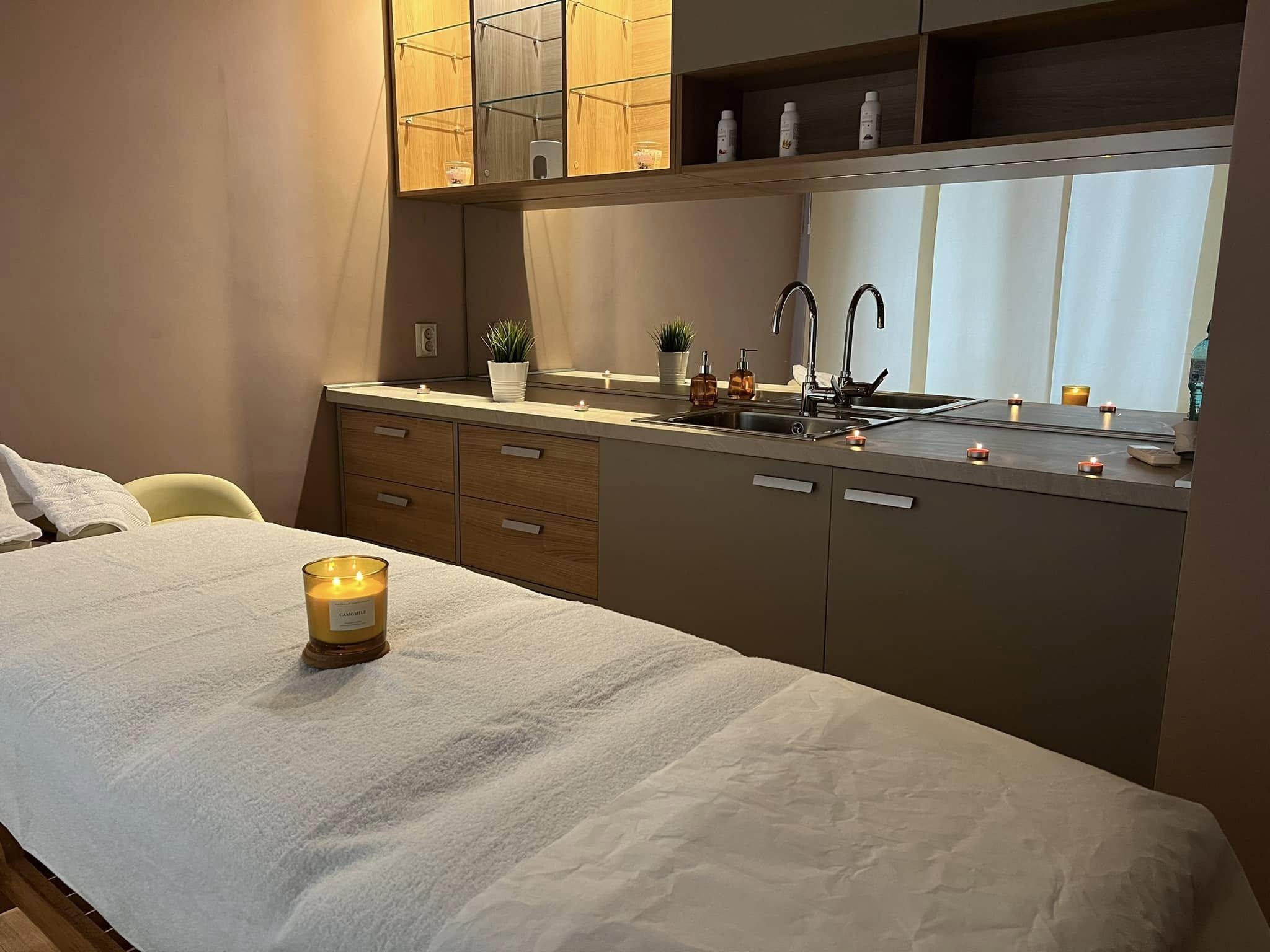 Candle-lit treatment room at dusk